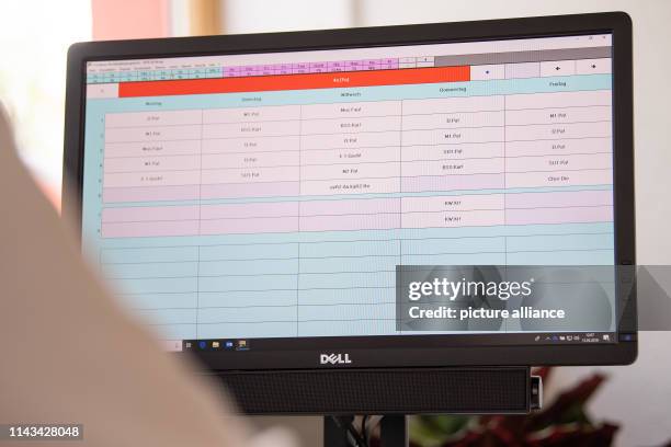 May 2019, Baden-Wuerttemberg, Remshalden: A teacher is sitting in front of her computer, which is running a program to create timetables. Photo:...
