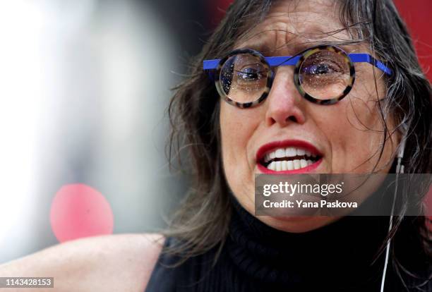 Activist Suzannah Troy from Brooklyn, holds up a sign as a line of people awaits entry to the trial of Officer Daniel Pantaleo at One Police Plaza on...