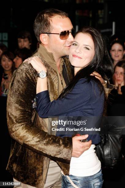 Actor Bjoern Casapietra and girlfriend Anne Kathrin Wagner attend the 'Grand Opening Cinema Berlin' with the screening of 'Pirates Of The Caribbean:...