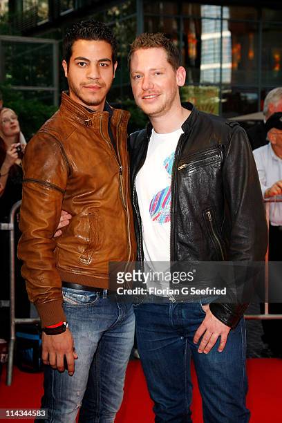 Director Marco Kreuzpaintner and partner Gilardi attend the 'Grand Opening Cinema Berlin' with the screening of 'Pirates Of The Caribbean: On...