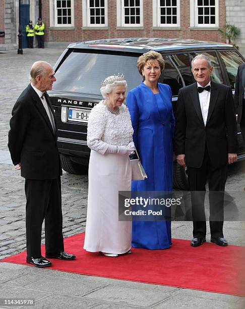Prince Philip, Duke of Edinburgh and Queen Elizabeth II arrive with Irish President Mary McAleese and her husband Dr. Martin McAleese for a State...