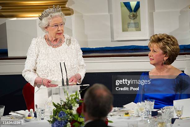 Queen Elizabeth II makes a speech as she attends the State Dinner on the second day of her State Visit, at Dublin Castle, on May 18, 2011 in Dublin,...