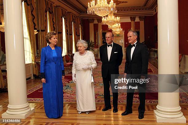 Irish President Mary McAleese, Queen Elizabeth II, Prince Philip, Duke of Edinburgh and Dr. Martin McAleese attend a State Dinner at Dublin Castle,...