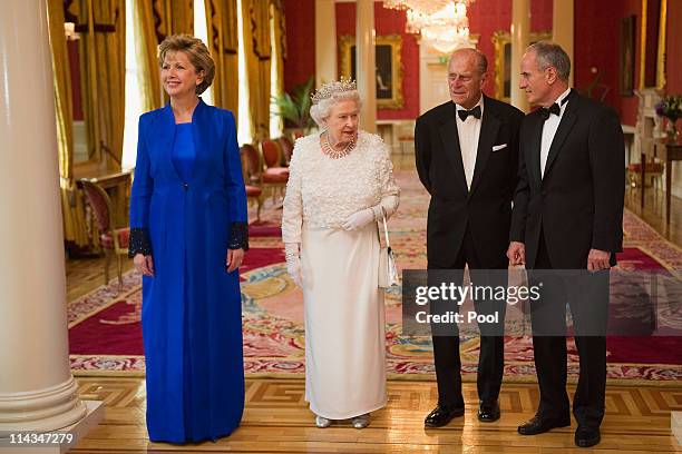Queen Elizabeth II and Prince Philip, the Duke of Edinburgh attend the State Banquet in Dublin Castle hosted by the Irish President Mary McAleese and...