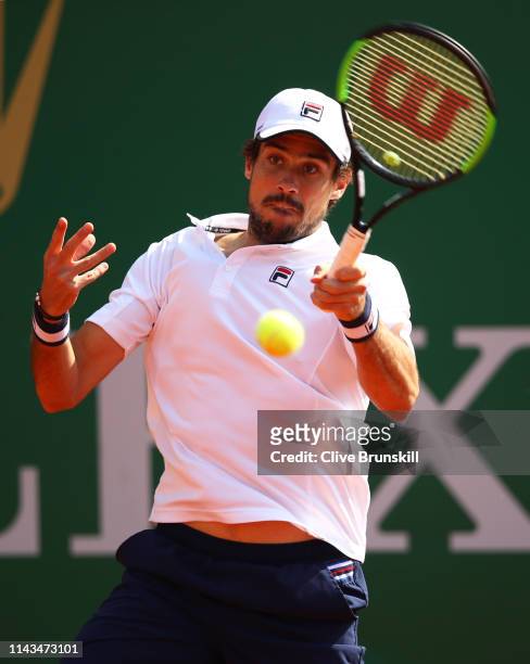 Guido Pella of Argentina plays a forehand against Marco Cecchinato of Italy in their third round match during day five of the Rolex Monte-Carlo...