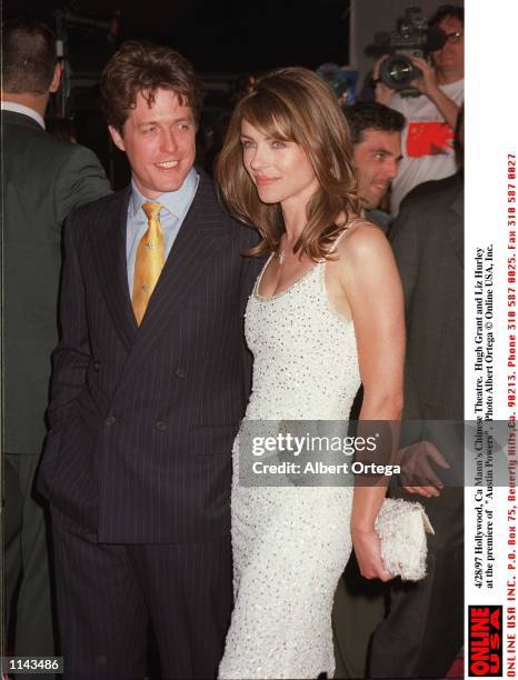 Hollywood, CA Liz Hurley and Hugh Grant at the premiere of the movie "Austin Powers"