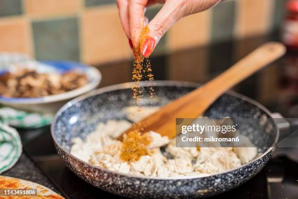 preparing pizza in the kitchen for dinner. - condiment stock-fotos und bilder