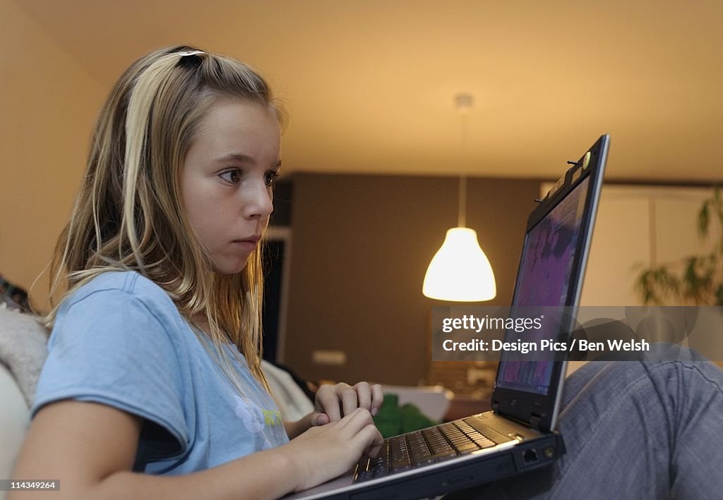 Girl Using A Laptop Computer High-Res Stock Photo - Getty Images