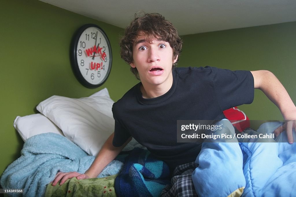 A Teenage Boy Getting Out Of Bed Late