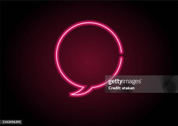 red speech bubble neon light on black wall - neon speech bubble stock illustrations