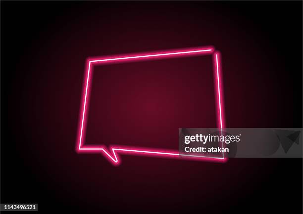 red speech bubble neon light on black wall - neon speech bubble stock illustrations