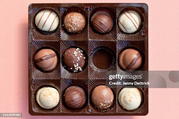 chocolates in a box - undone stock pictures, royalty-free photos & images