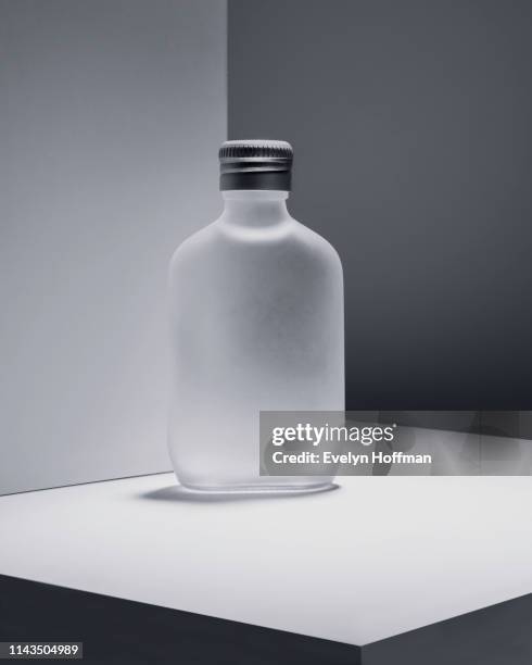 monochromatic still life with bottle - flachmann stock-fotos und bilder