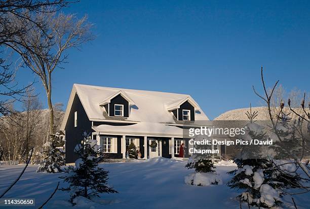 a house covered in snow in winter - front door winter stock pictures, royalty-free photos & images