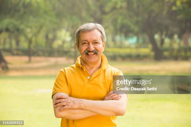 senior men - stock images - polo tee stock pictures, royalty-free photos & images