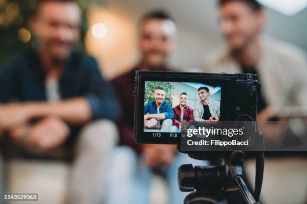 three friends doing a vlog video together - television camera stock pictures, royalty-free photos & images