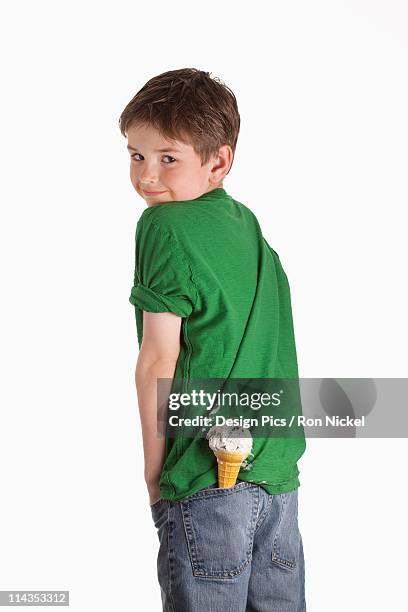 a boy with an ice cream cone in his back pocket - back pocket stock pictures, royalty-free photos & images