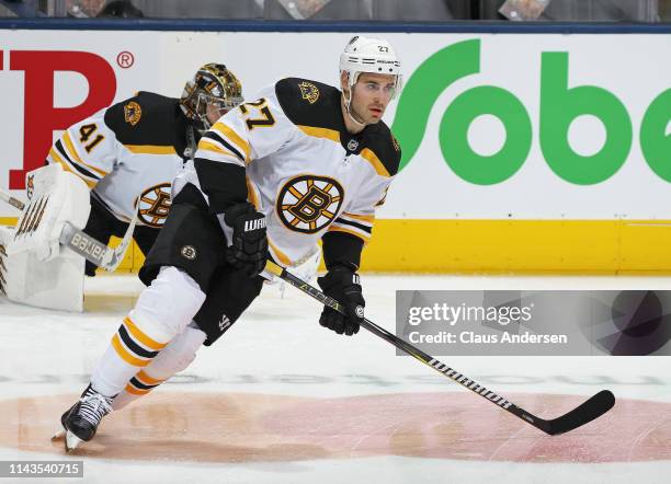 John Moore of the Boston Bruins warms up prior to action against the Toronto Maple Leafs in Game Four of the Eastern Conference First Round during...