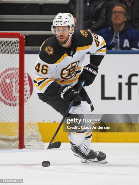 David Krejci of the Boston Bruins skates with the puck against the Toronto Maple Leafs in Game Four of the Eastern Conference First Round during the...