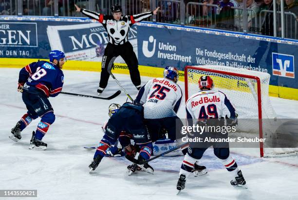 Ben Smith of Mannheim scores the first goal for his team during the first game of the DEL Play-Offs Final between Adler Mannheim and EHC Red Bull...
