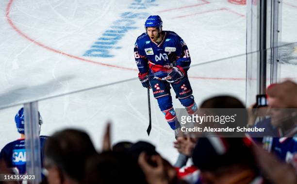 Ben Smith of Mannheim celebrates the first goal for his team during the first game of the DEL Play-Offs Final between Adler Mannheim and EHC Red Bull...