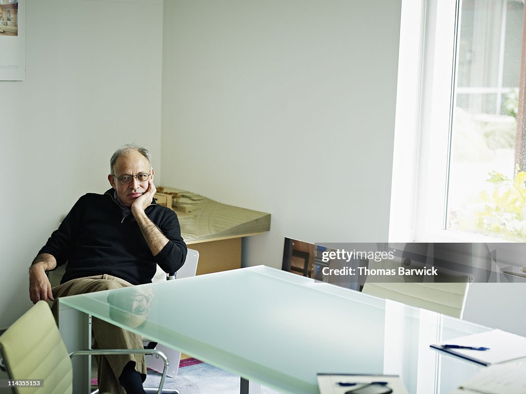 Businessman sitting at conference room table