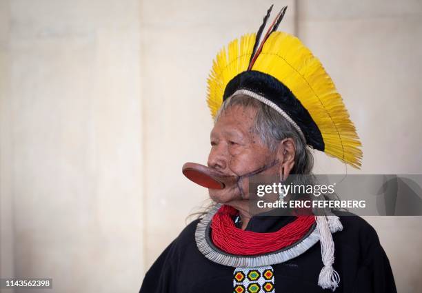 Brazil's indigenous chief Raoni Metuktire looks on as he is welcomed by French Minister for the Ecological and Inclusive Transition in Paris on May...