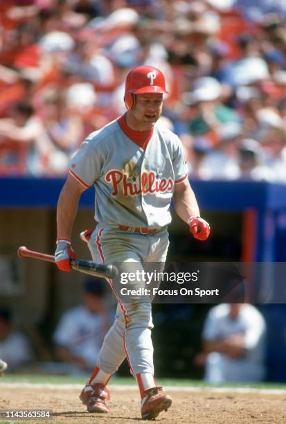 Lenny Dykstra of the Philadelphia Phillies walks back to the dugout after striking out against the New York Mets during a Major League Baseball game...