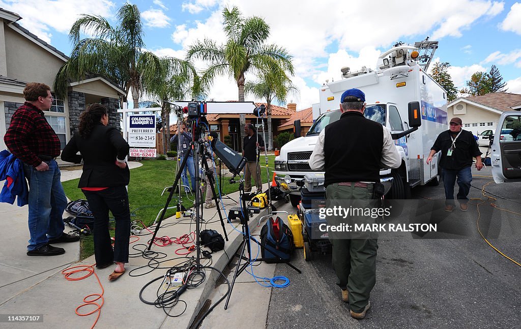Media wait outside the home of Mildred P