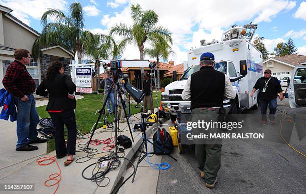 Media wait outside the home of Mildred Patricia Baena, the former maid who mothered a child by actor and former Californian Governor Arnold...