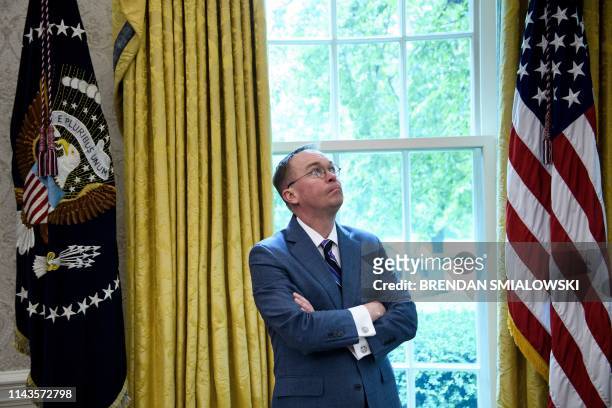 White House acting Chief of Staff Mick Mulvaney listens while US President Donald Trump speaks to the press before a meeting with Hungary's Prime...