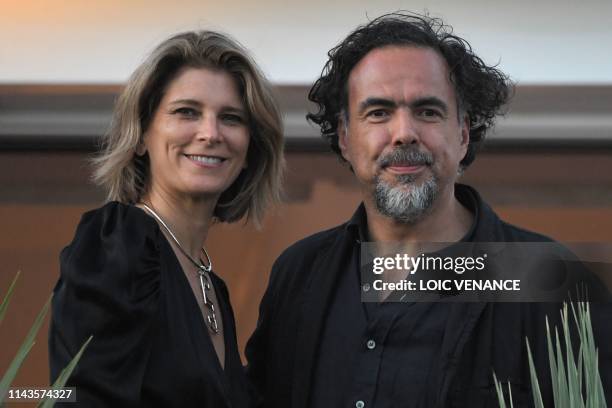 Mexican director and President of the Jury of the Cannes Film Festival Alejandro Gonzalez Inarritu and his wife Maria Eladia Hagerman pose on May 13,...