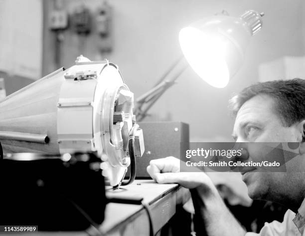 Professor James Van Allen of the University of Iowa observing the cone-shaped Pioneer probe from the JPL Explorer satellite, 1959. Image courtesy...