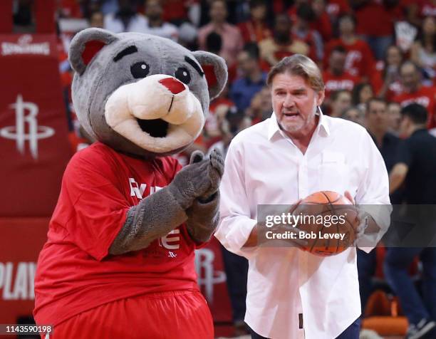 Former Houston Oilers quarterback Dan Pastorini shoots the Houston Rockets First Shot For Charity during Game Two of the first round of the 2019 NBA...