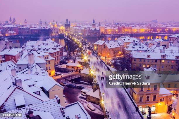 winter in prague - city panorama with charles bridge - st vitus cathedral prague stock pictures, royalty-free photos & images