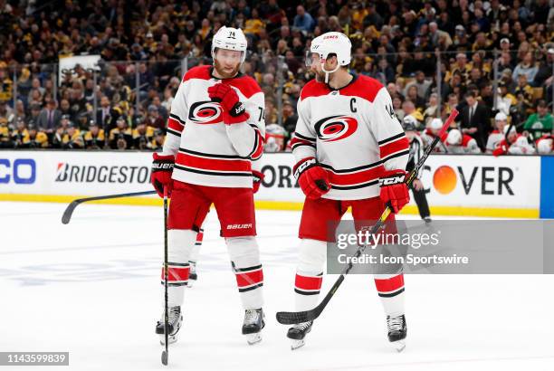 Carolina Hurricanes defenseman Jaccob Slavin and Carolina Hurricanes right wing Justin Williams discuss a face off during Game 2 of the Stanley Cup...