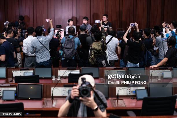 Group of Pro-democracy lawmakers are surrounded by photojournalist inside the conference room during discussions on extradition laws in Legislative...