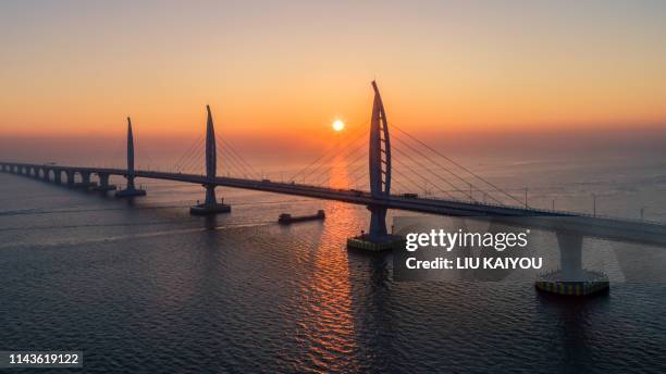 large bridge with beautiful sunset - zhuhai stock pictures, royalty-free photos & images