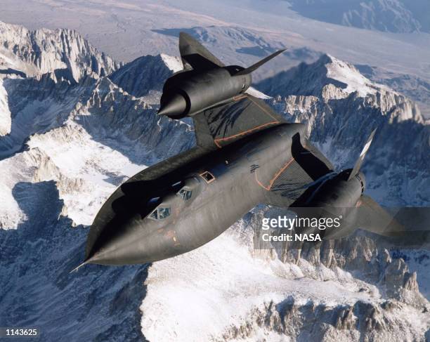 Blackbird aerial reconnaissance aircraft photographed over snow capped mountains in 1995.