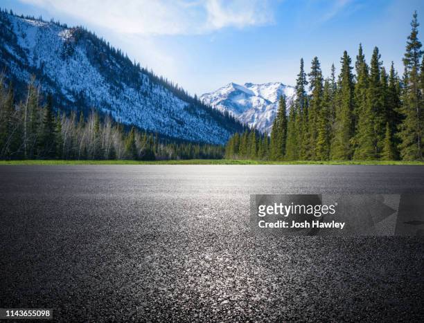 outdoor road and parking lot - snow on grass stock pictures, royalty-free photos & images