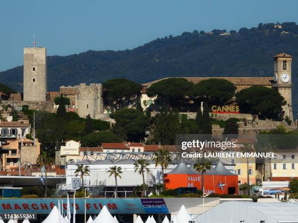 The Festival Palace and the Notre-Dame d'Esperance church in the Suquet district are pictured on May 14 on the opening day of the 72nd Cannes Film...