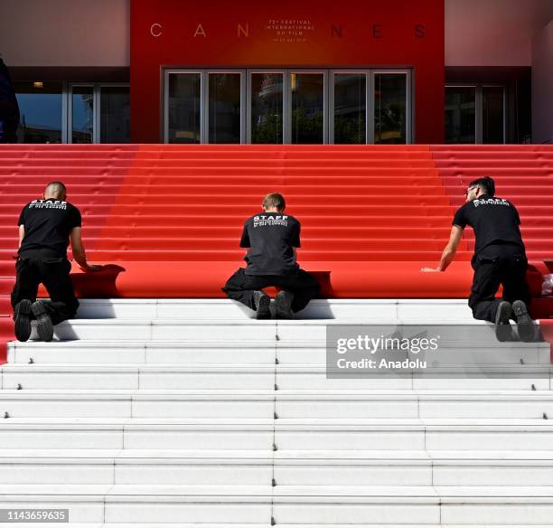 Staff of Palais des Festivals and Congress install red carpet in front of Palais des Festival in Cannes, France on May 14, 2019.