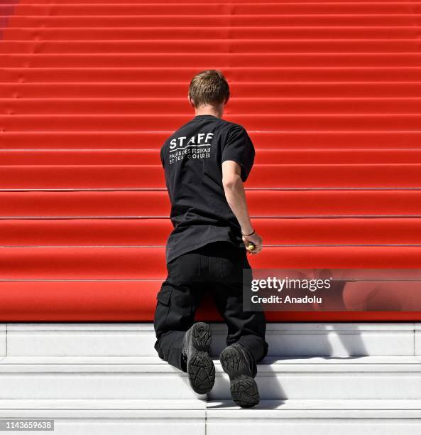 Staff of Palais des Festivals and Congress install red carpet in front of Palais des Festival in Cannes, France on May 14, 2019.