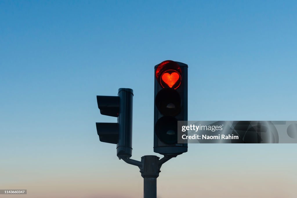 Heart-shaped red stop traffic light in Akureyri, Iceland