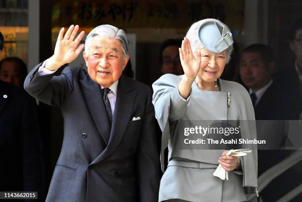 Emperor Akihito and Empress Michiko wave to well-wishers on arrival at Kashikojima Station on April 19, 2019 in Shima, Mie, Japan. The emperor will...