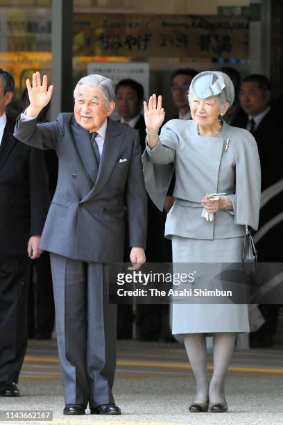 Emperor Akihito and Empress Michiko wave to well-wishers on arrival at Kashikojima Station on April 19, 2019 in Shima, Mie, Japan. The emperor will...