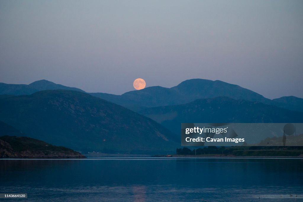 Strawberry moon rise over the An Tellach mountain range