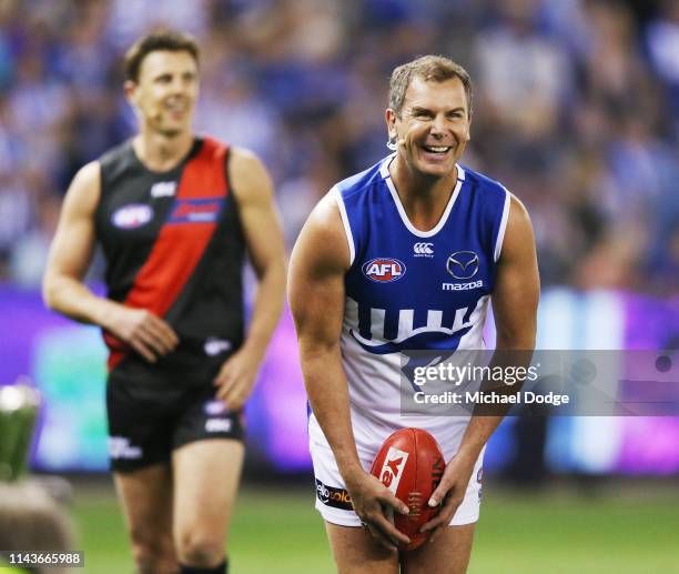 Bombers legend Matthew Lloyd and Kangaroos legend Wayne Carey take part in the Kick For The Kids fundraiser during the round 5 AFL match between...