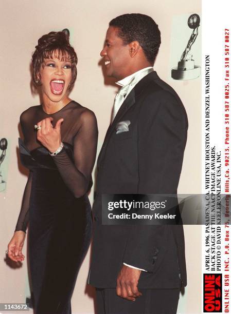 04/06/96. PASADENA, CA. WHITNEY HOUSTON AND DENZEL WASHINGTON BACKSTAGE AT THE NAACP IMAGE AWARDS.