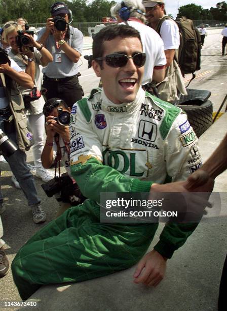 Scottish CART Dario Franchitti is congratulated after learning he had won the pole position 19 August 2000 for the Motorola 220 at Road America. AFP...